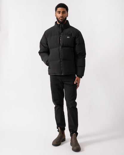 full length shot of a model wearing a Lacoste Water-Repellent Packable Hood Mens Down Jacket in Black