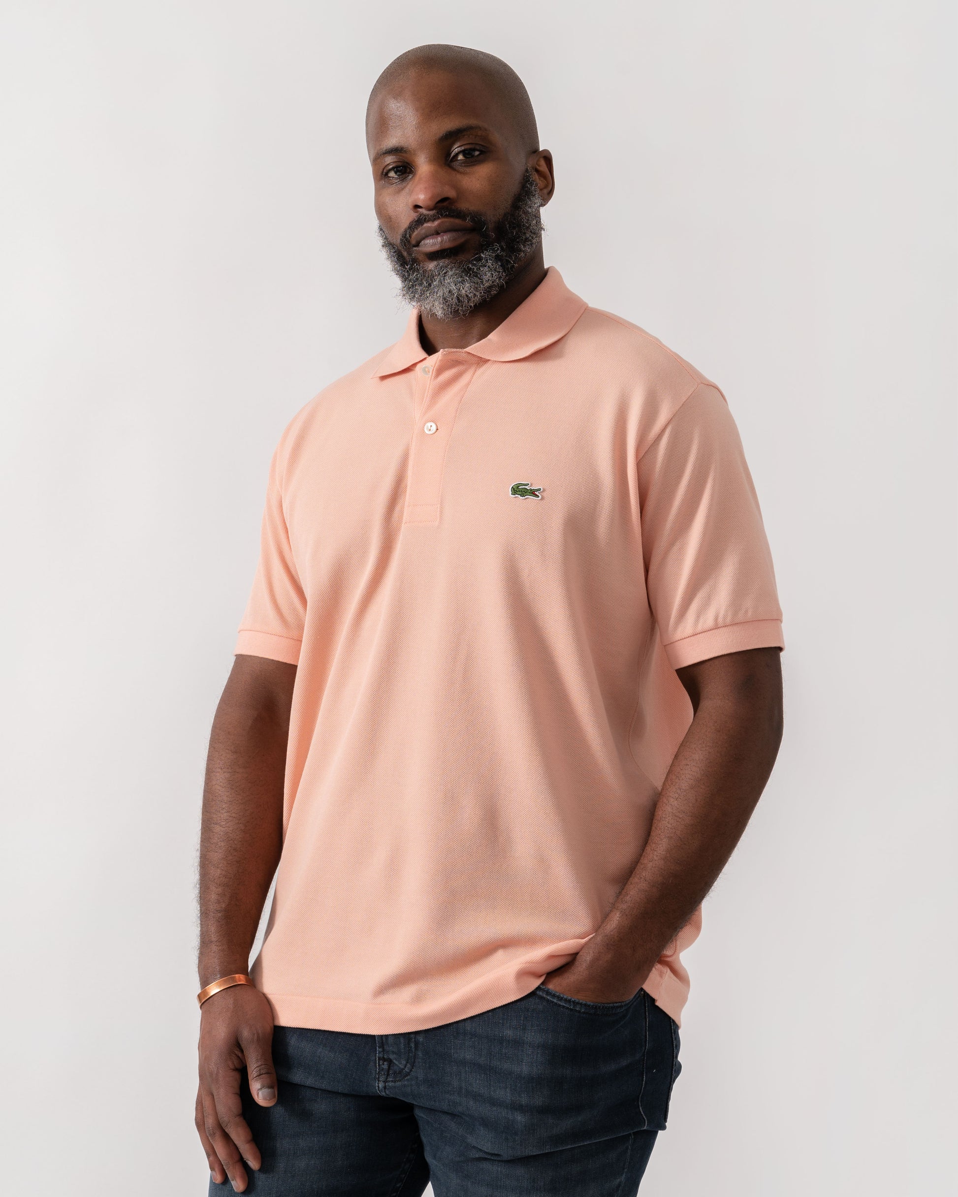 Model wearing Lacoste Classic Fit L.12.12 Mens Short Sleeve Polo Shirt in Miami UI2 - Main
