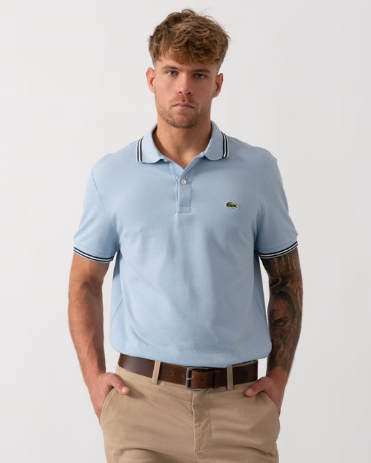 Model wearing Lacoste Contrast Collar Pique Mens Regular Fit Polo Shirt in Chambray - Main