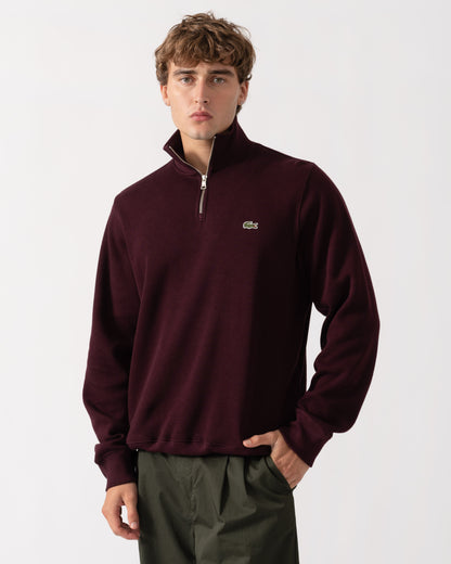 Man wearing Lacoste Mens Zippered Stand-Up Collar Cotton Sweatshirt - Chestnut Brown 3KE