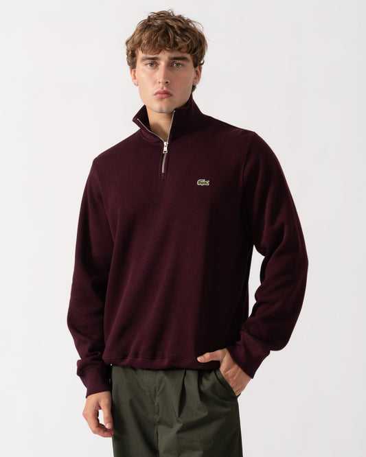 Man wearing Lacoste Mens Zippered Stand-Up Collar Cotton Sweatshirt - Chestnut Brown 3KE