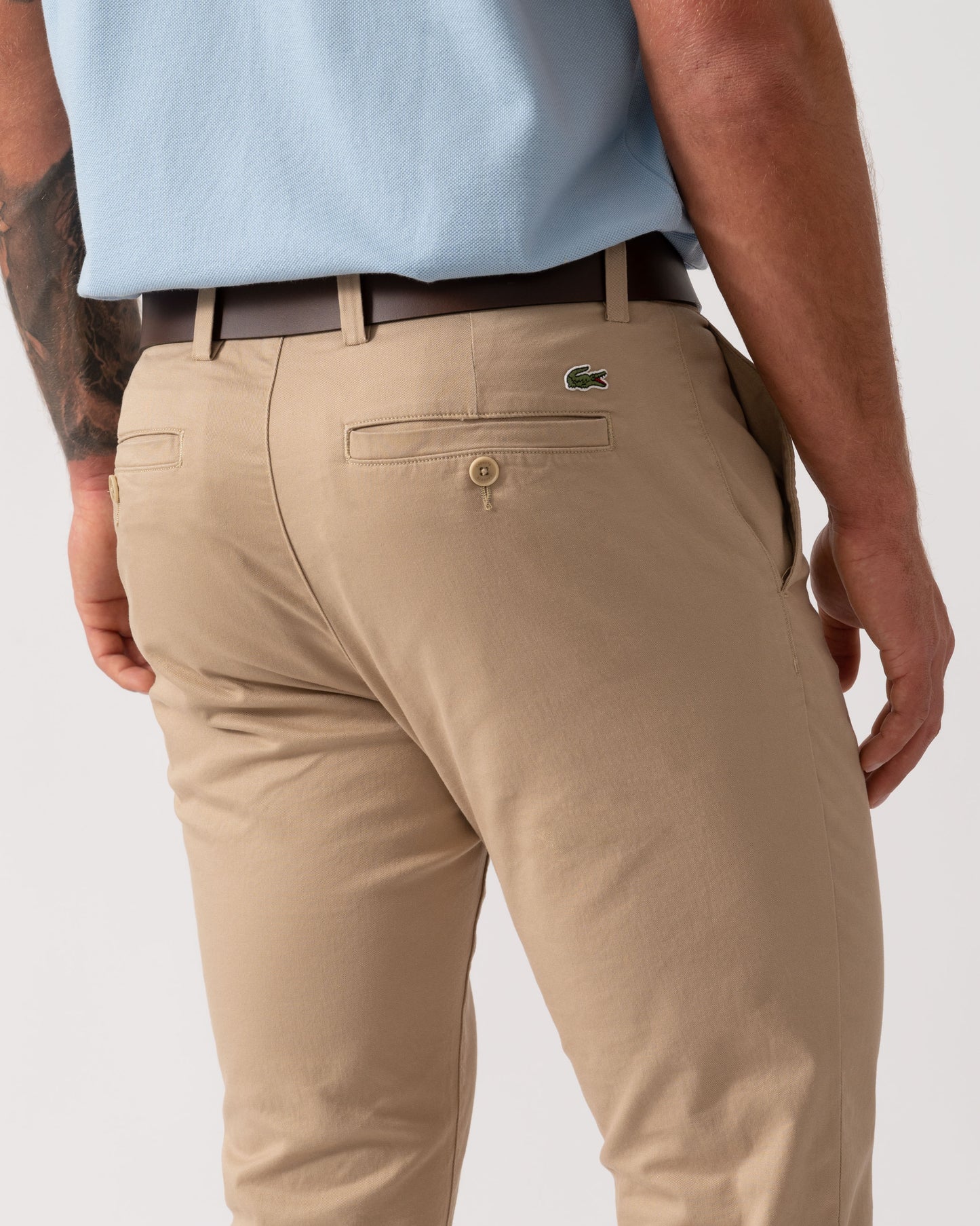 Model wearing Lacoste Slim Fit Stretch Cotton Mens Chinos in Viennese 02S - Back detail