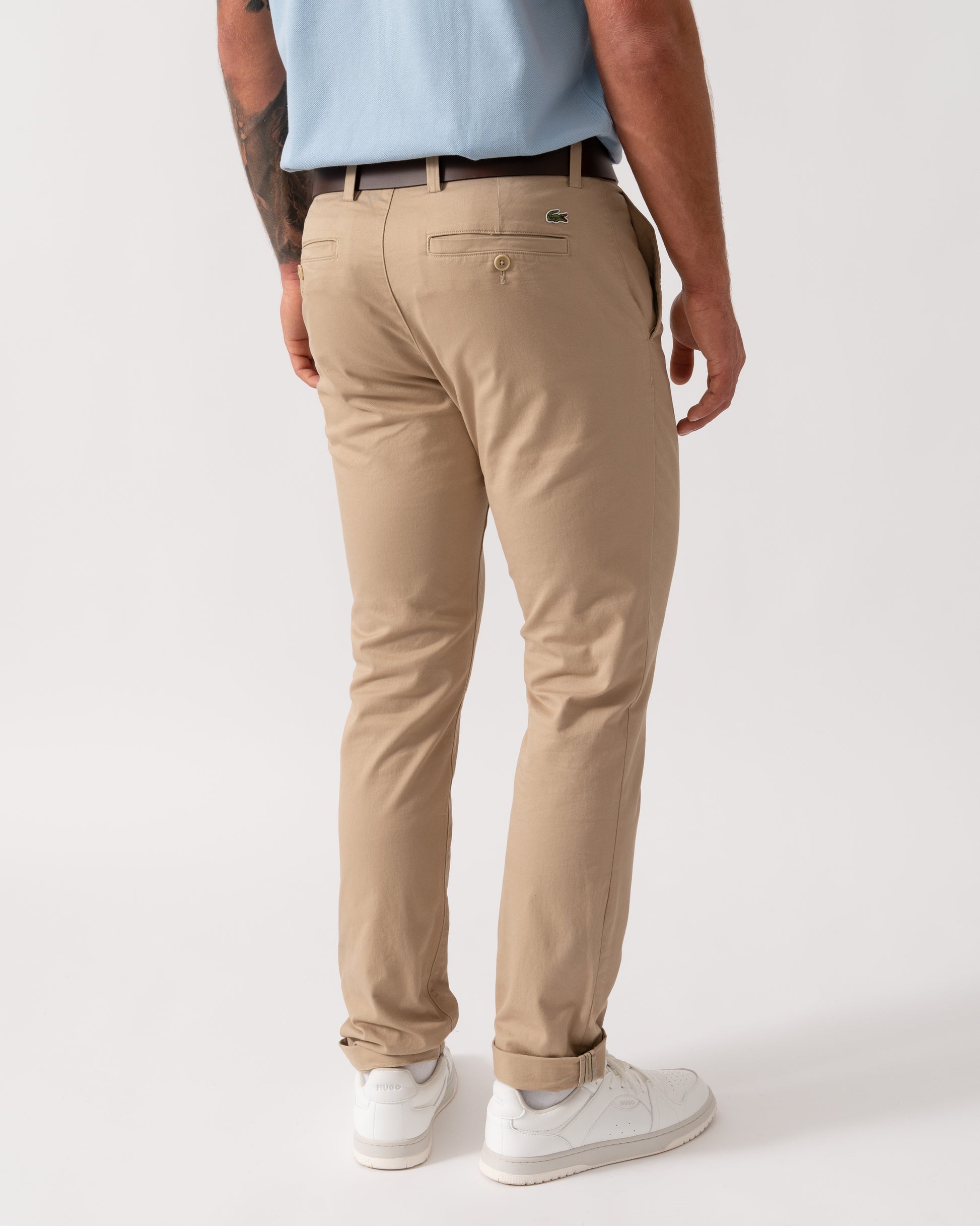 Model wearing Lacoste Slim Fit Stretch Cotton Mens Chinos in Viennese 02S - Back