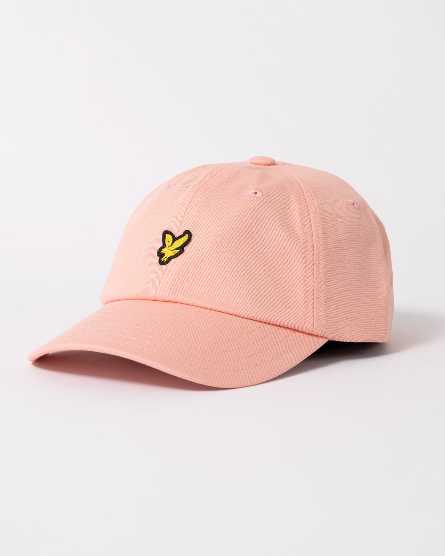 side of Lyle & Scott Baseball Cap in Y120 Pink Grapefruit