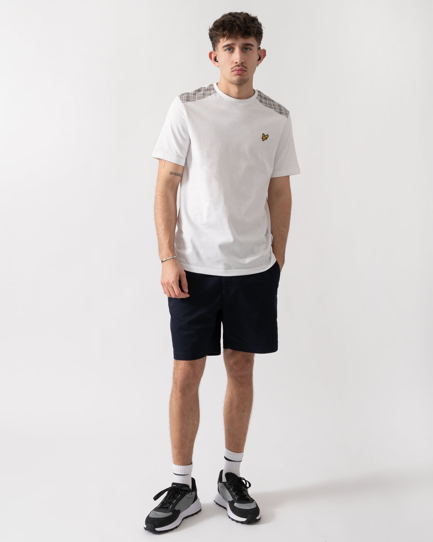 full length shot of a model wearing a Lyle & Scott Check Panelled Mens T-Shirt in 626 White