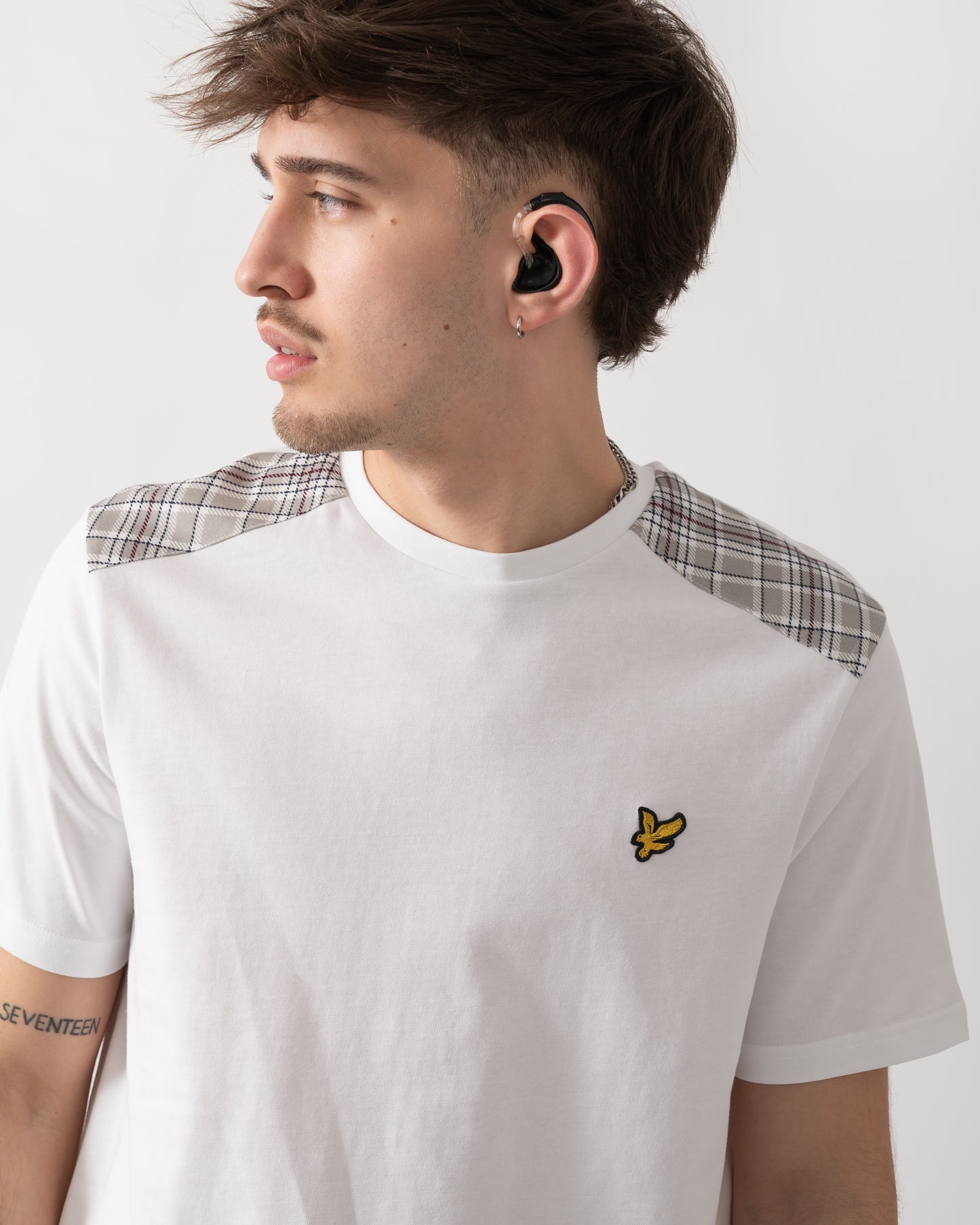 close up shot of a model wearing a Lyle & Scott Check Panelled Mens T-Shirt in 626 White