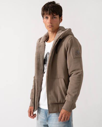 side of amodel wearing a Moose Knuckles Classic Bunny 3 Mens Fleece Hoodie in Ashen 2019