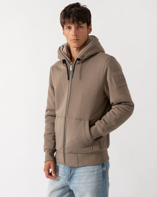 model wearing a Moose Knuckles Classic Bunny 3 Mens Fleece Hoodie in Ashen 2019