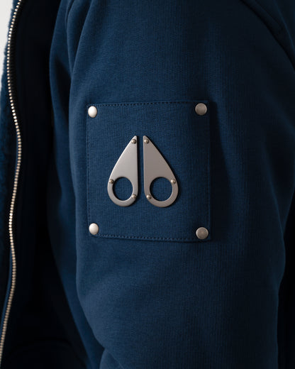 logo detail of a Moose Knuckles Classic Bunny 3 Mens Fleece Hoodie in Nightfall 2017 