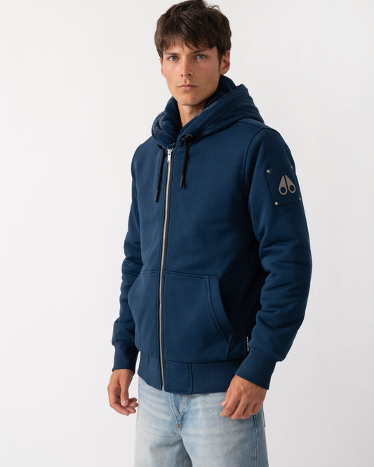 model wearing a Moose Knuckles Classic Bunny 3 Mens Fleece Hoodie in Nightfall 2017 