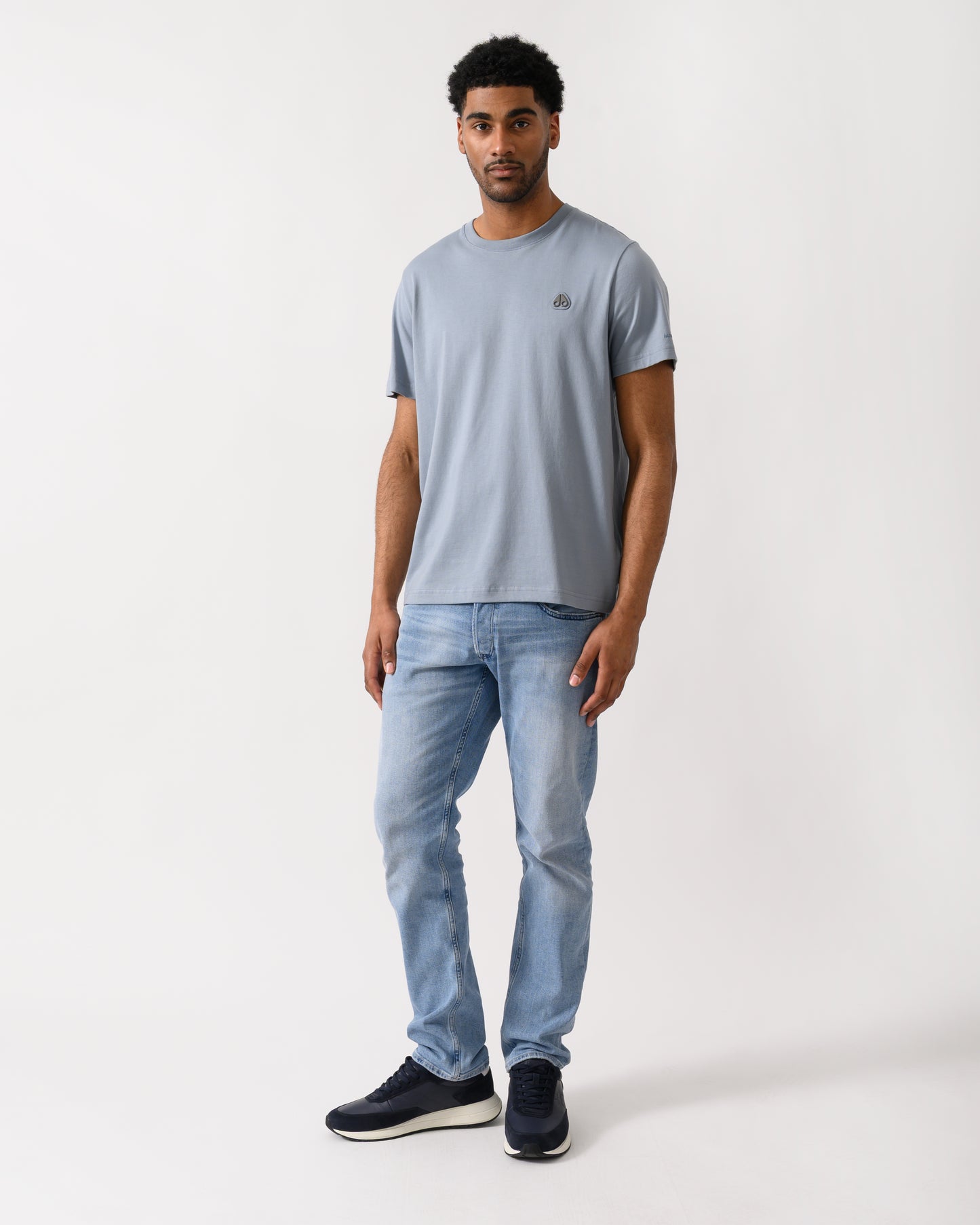 full length shot of a model wearing a Moose Knuckles Crescent Mens T-Shirt in Jet Stream 1884