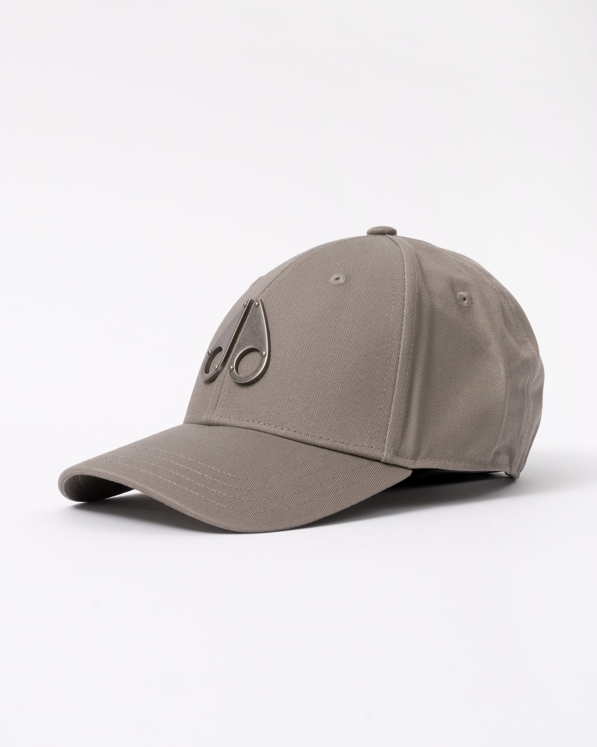side view of a Moose Knuckles Front Logo Icon Cap in Ashen 1968