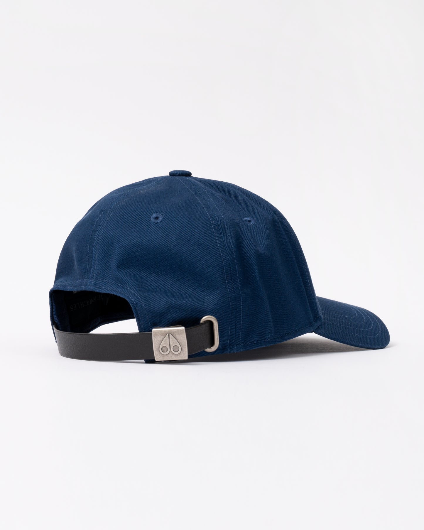 back view of a Moose Knuckles Front Logo Icon Cap in Nightfall 1977