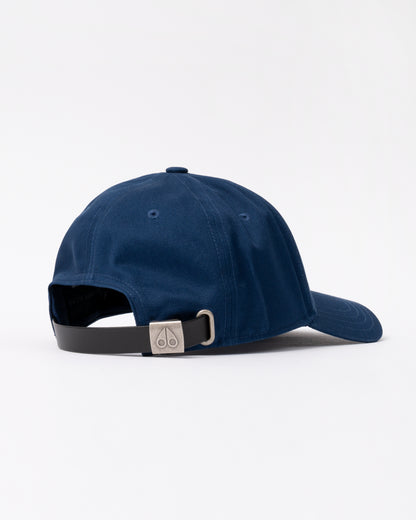 back view of a Moose Knuckles Front Logo Icon Cap in Nightfall 1977