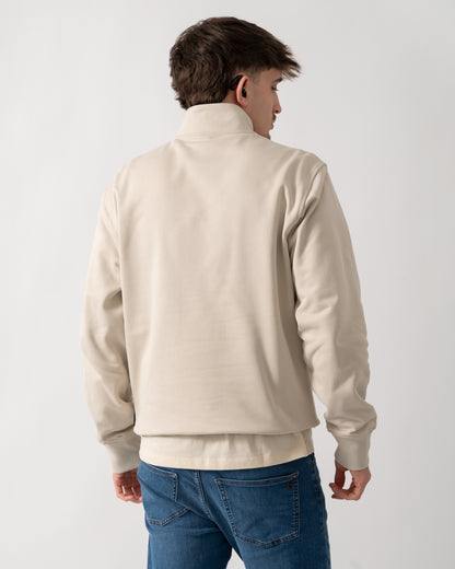 back shot of a model wearing a Moose Knuckles Hartsfield Mens 1/4 Zip Sweatshirt in Alabaster 1705