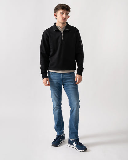 full length shot of a model wearing a Moose Knuckles Hartsfield Mens quarter Zip Sweatshirt in Black 292