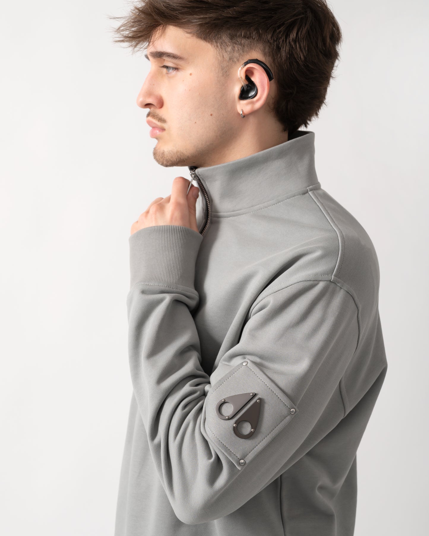 detail shot of a Moose Knuckles Hartsfield Mens 1/4 Zip Sweatshirt in Industry 1892