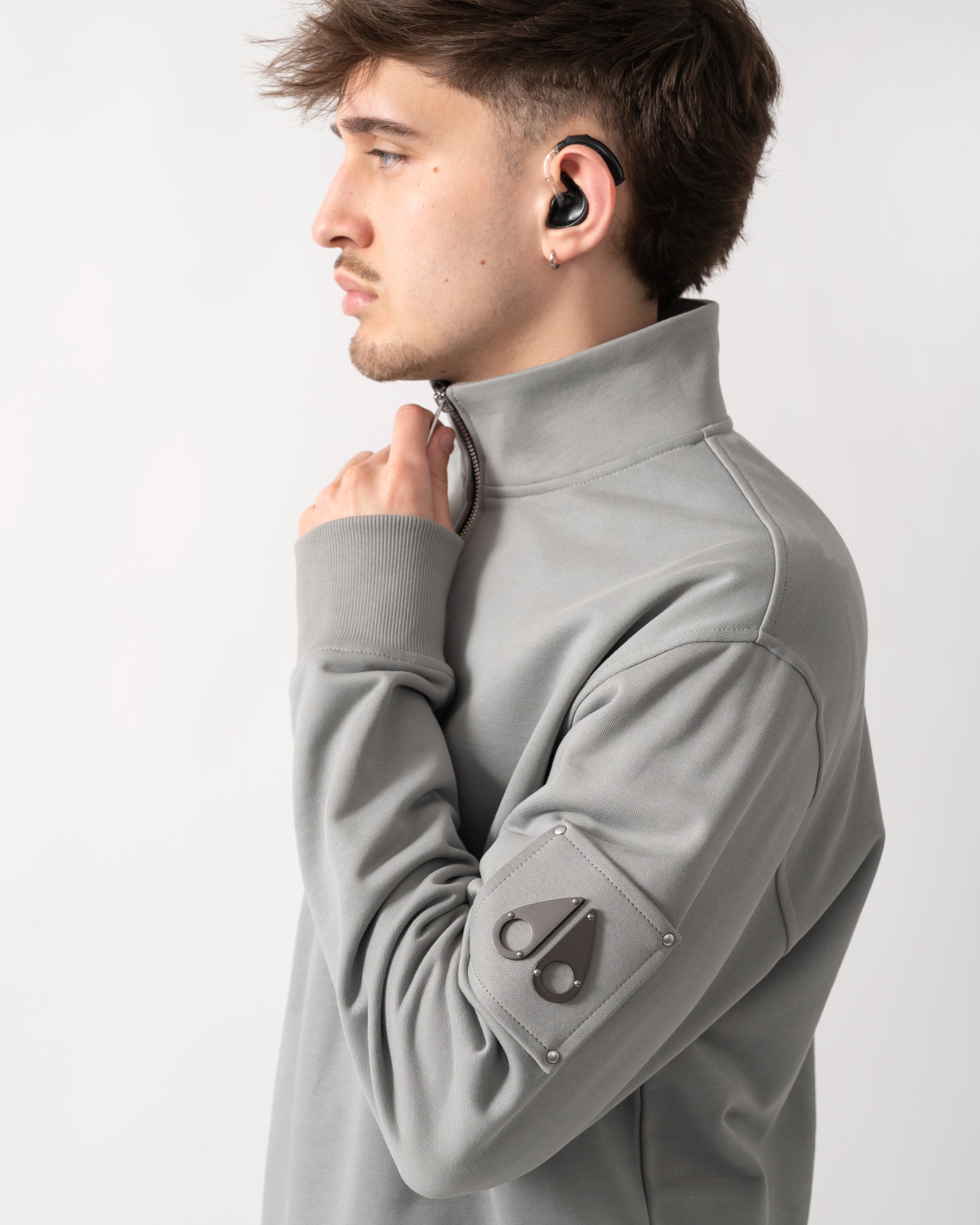 detail shot of a Moose Knuckles Hartsfield Mens 1/4 Zip Sweatshirt in Industry 1892