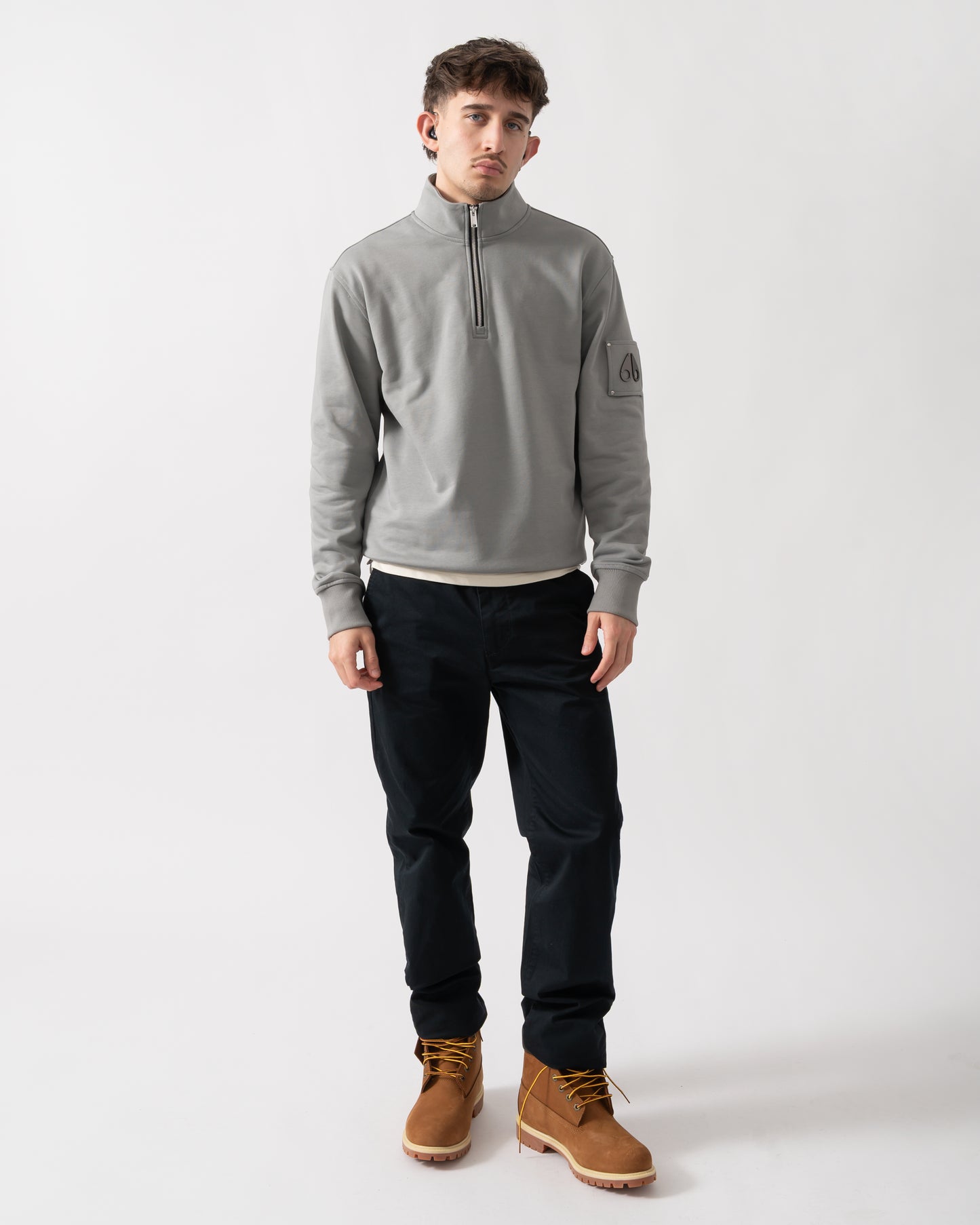 full length shot of a Moose Knuckles Hartsfield Mens 1/4 Zip Sweatshirt in Industry 1892
