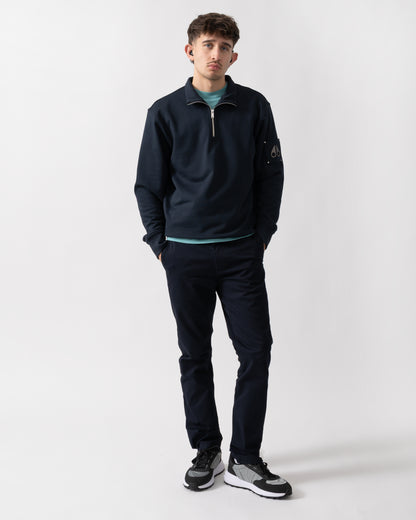 full length shot of a model wearing a Moose Knuckles Hartsfield Mens quarter Zip Sweatshirt in Navy 833