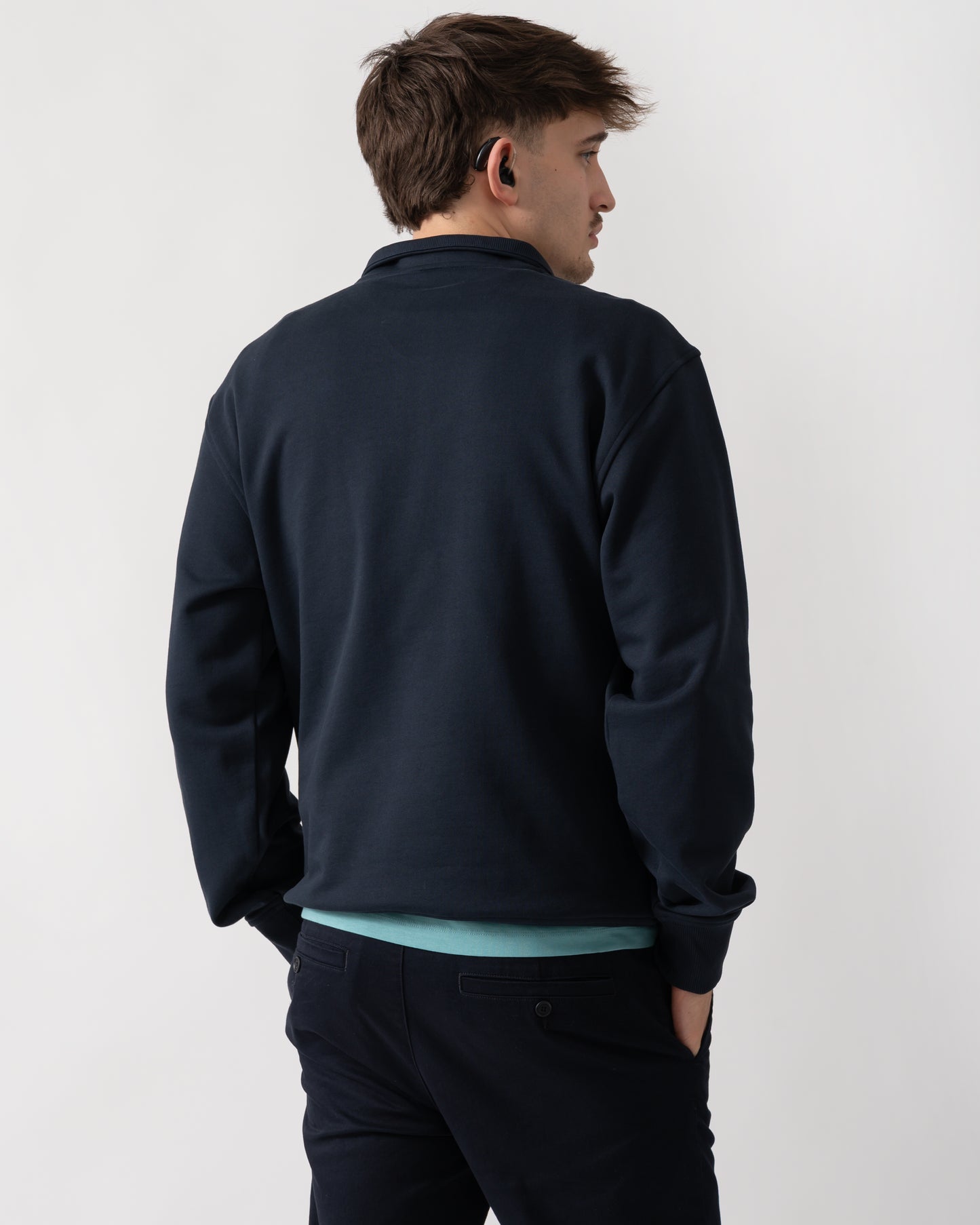 back shot of a model wearing a Moose Knuckles Hartsfield Mens quarter Zip Sweatshirt in Navy 833