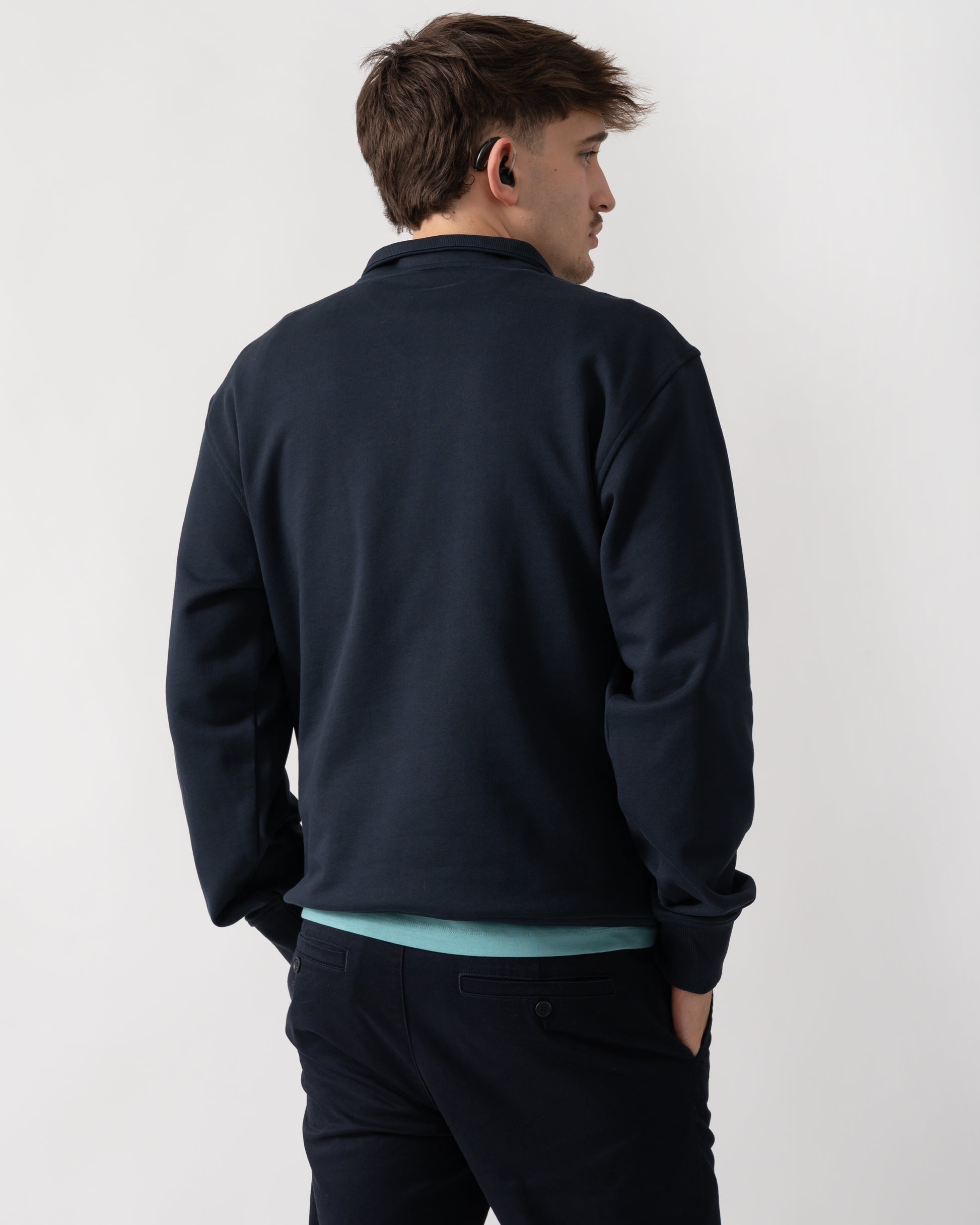back shot of a model wearing a Moose Knuckles Hartsfield Mens quarter Zip Sweatshirt in Navy 833