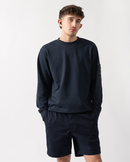 studio shot of a model wearing a Moose Knuckles Hartsfield Mens Crew Neck Sweatshirt in Navy 833