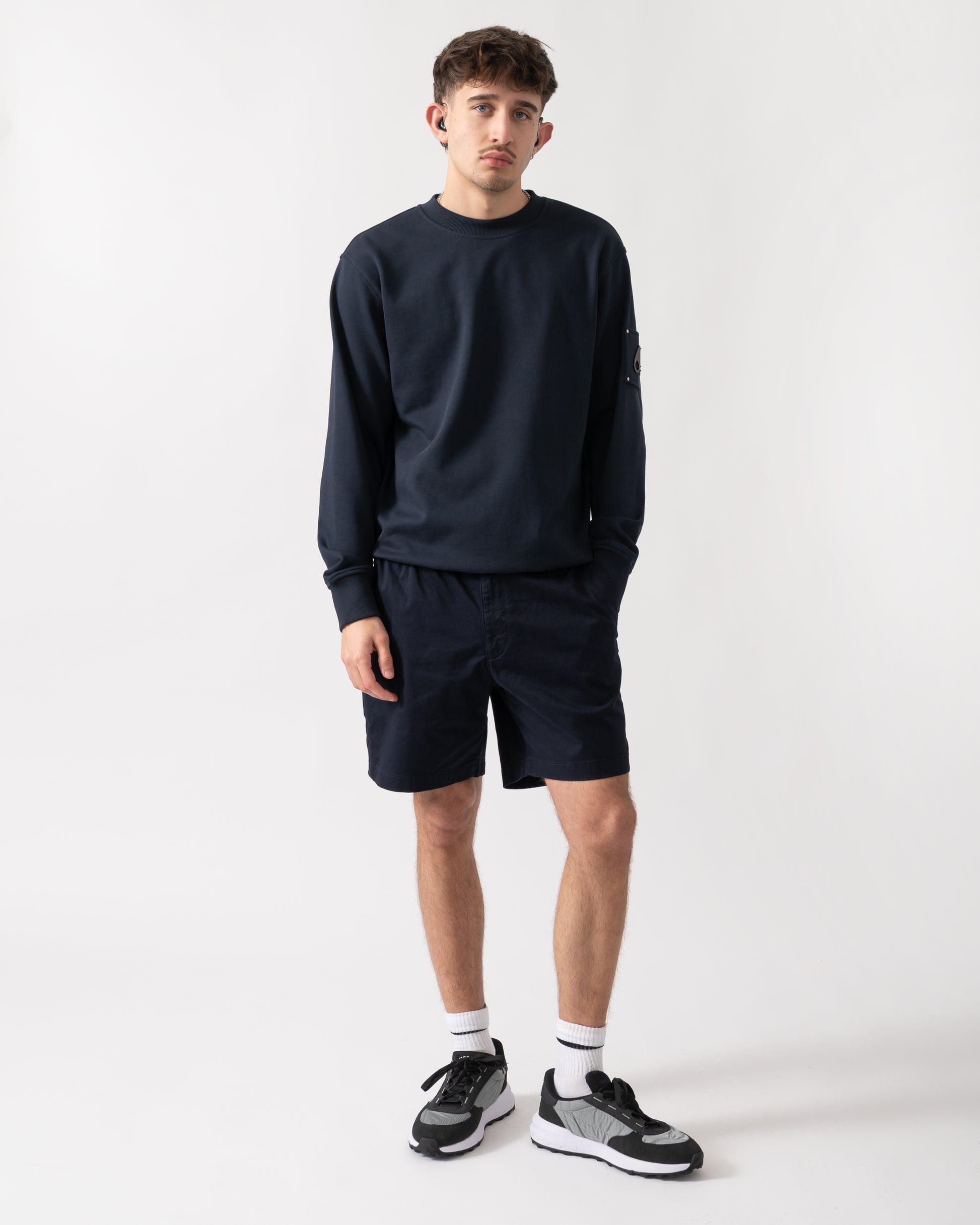 full length shot of a model wearing a Moose Knuckles Hartsfield Mens Crew Neck Sweatshirt in Navy 833