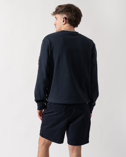 back shot of a model wearing a Moose Knuckles Hartsfield Mens Crew Neck Sweatshirt in Navy 833