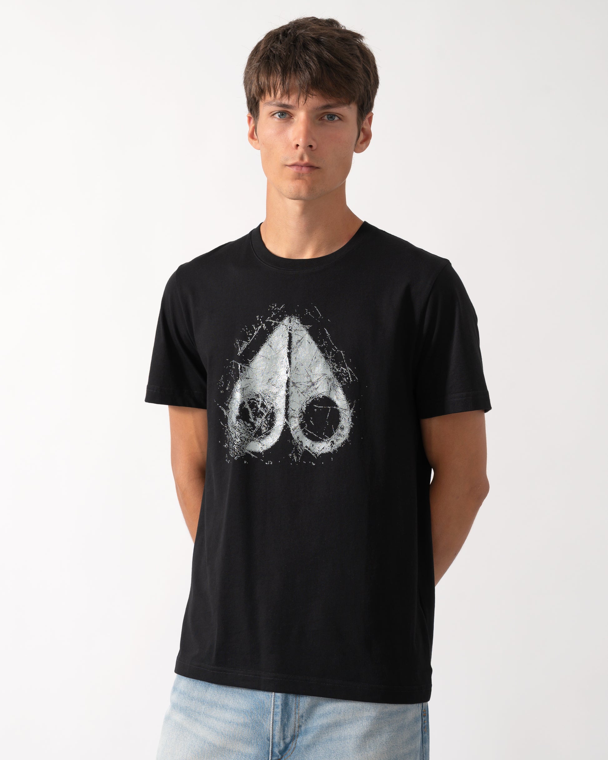 model wearing a Moose Knuckles Mens Icebreak Logo T-Shirt in Black 292