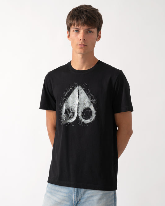 model wearing a Moose Knuckles Mens Icebreak Logo T-Shirt in Black 292
