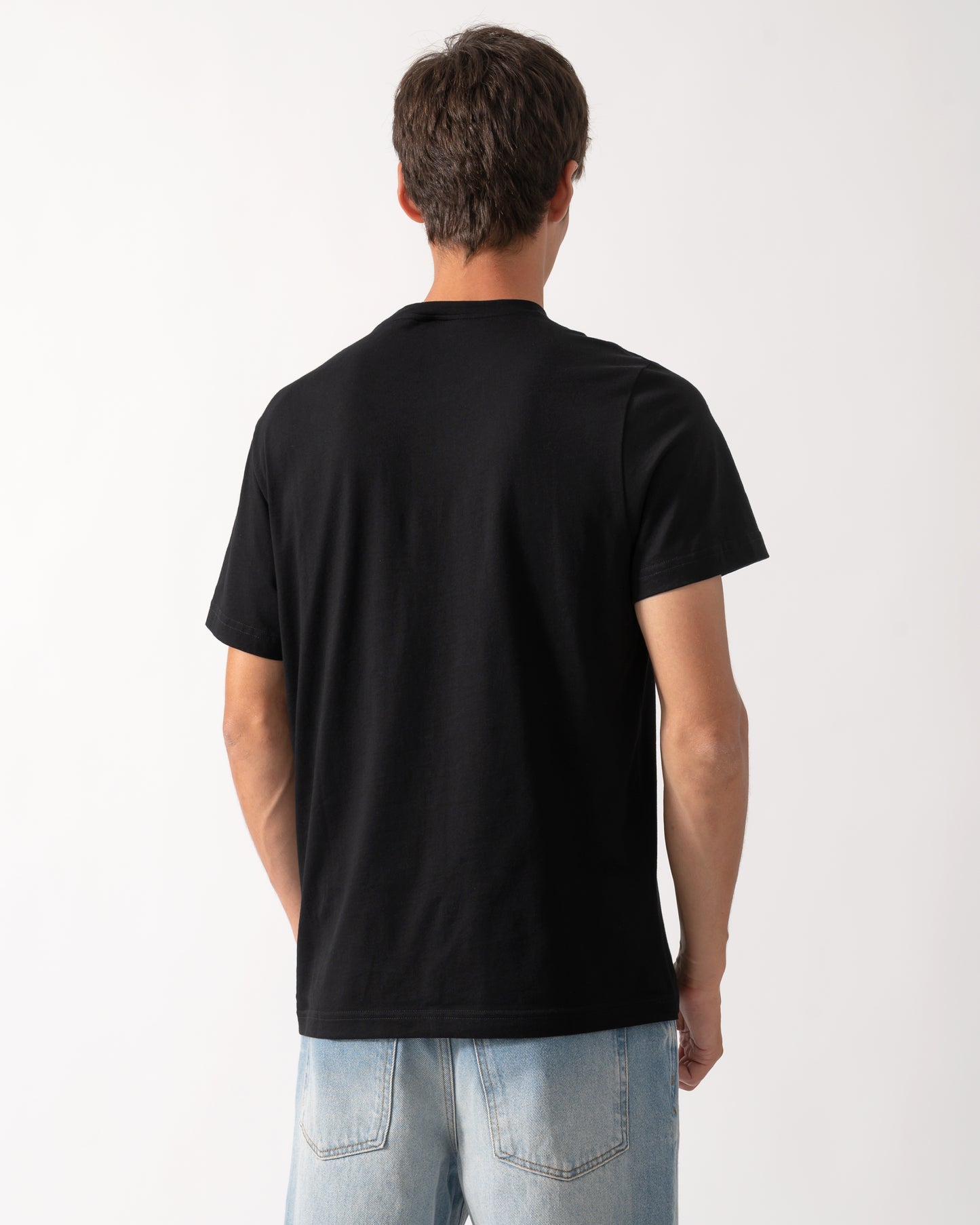 back of a model wearing a Moose Knuckles Mens Icebreak Logo T-Shirt in Black 292