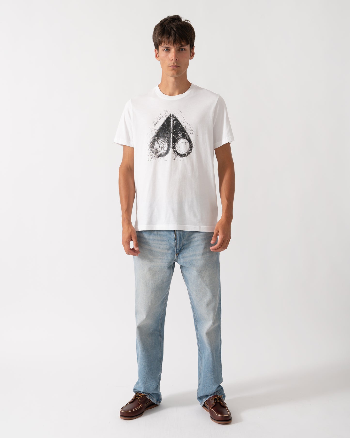 full length of a model wearing a Moose Knuckles Mens Icebreak Logo T-Shirt in White 160