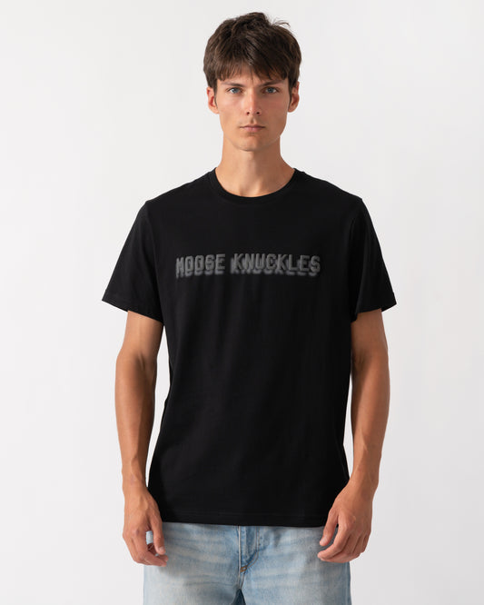 model wearing a Moose Knuckles Mens Shadow Logo T-Shirt in Black 292