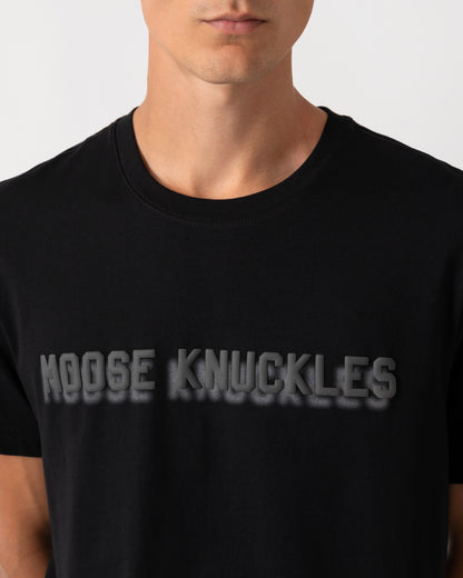 close up of a model wearing a Moose Knuckles Mens Shadow Logo T-Shirt in Black 292