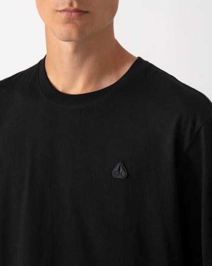 close up of model wearing a Moose Knuckles Mens Yul Classic T-Shirt in Black 292