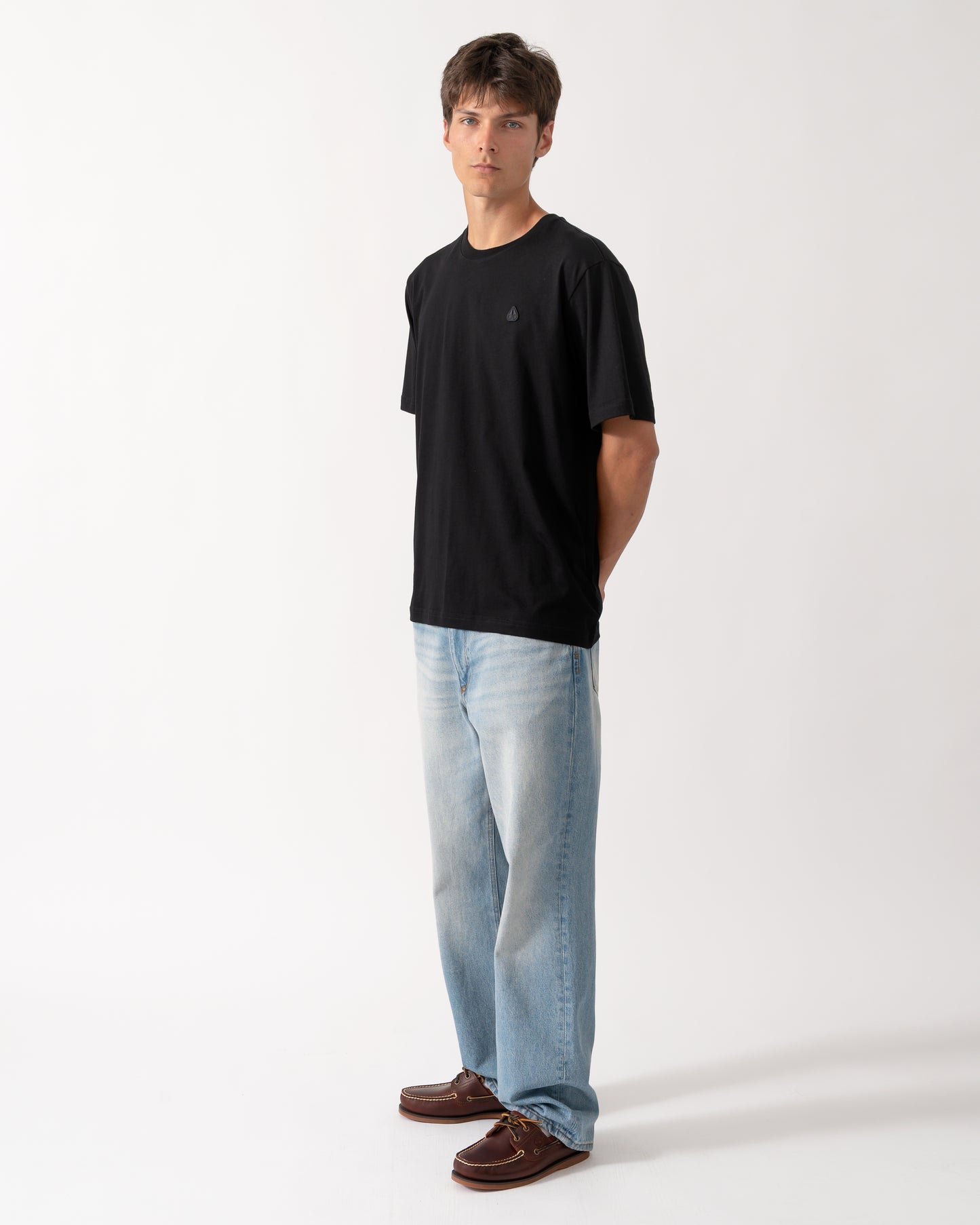 full length shot of a model wearing a Moose Knuckles Mens Yul Classic T-Shirt in Black 292