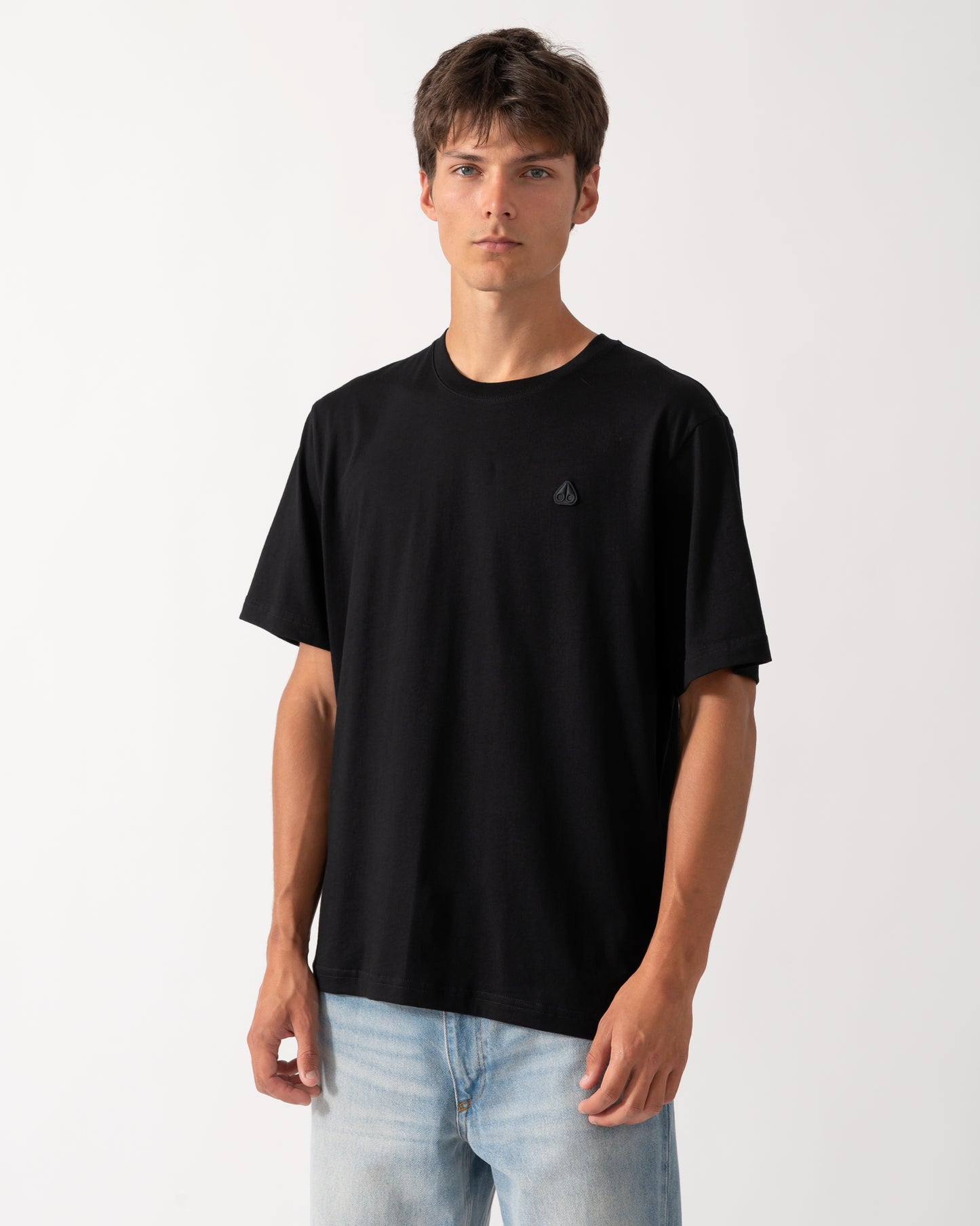 model wearing a Moose Knuckles Mens Yul Classic T-Shirt in Black 292