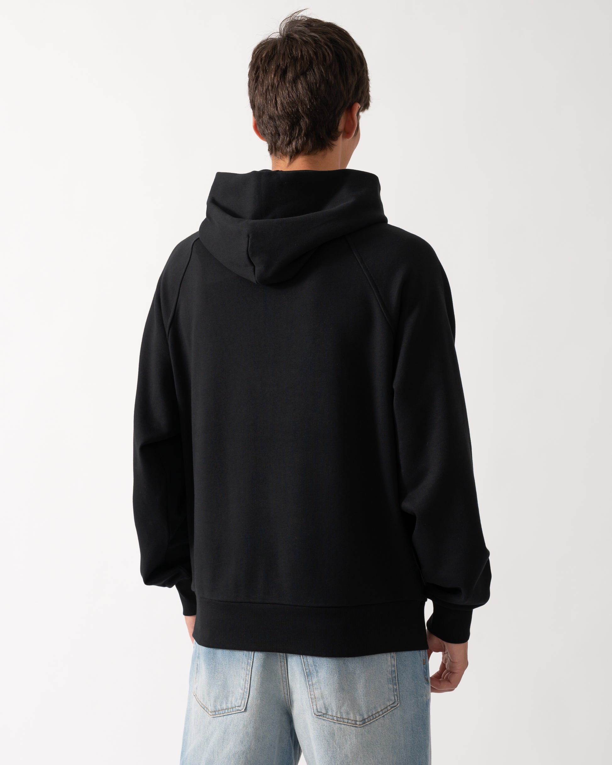 back of a model wearing a Moose Knuckles Mens Yul Pullover Hoodie in Black 292
