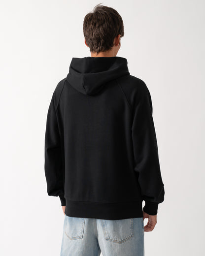 back of a model wearing a Moose Knuckles Mens Yul Pullover Hoodie in Black 292
