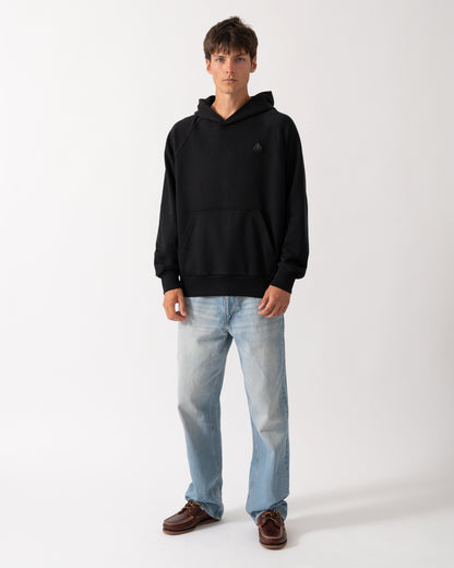 full length of a model wearing a Moose Knuckles Mens Yul Pullover Hoodie in Black 292