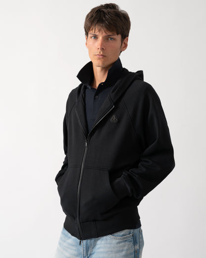 a model wearing a Moose Knuckles Mens Yul Zip Up Hoodie in Black 292