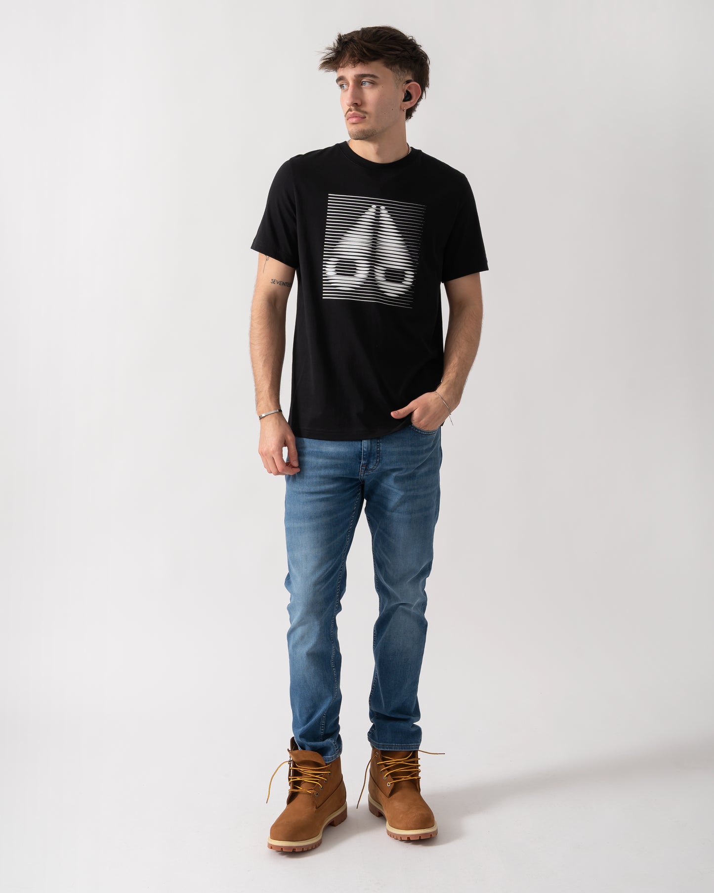 full length shot of a model wearing a Moose Knuckles Raydaze Mens T-Shirt in Black 292