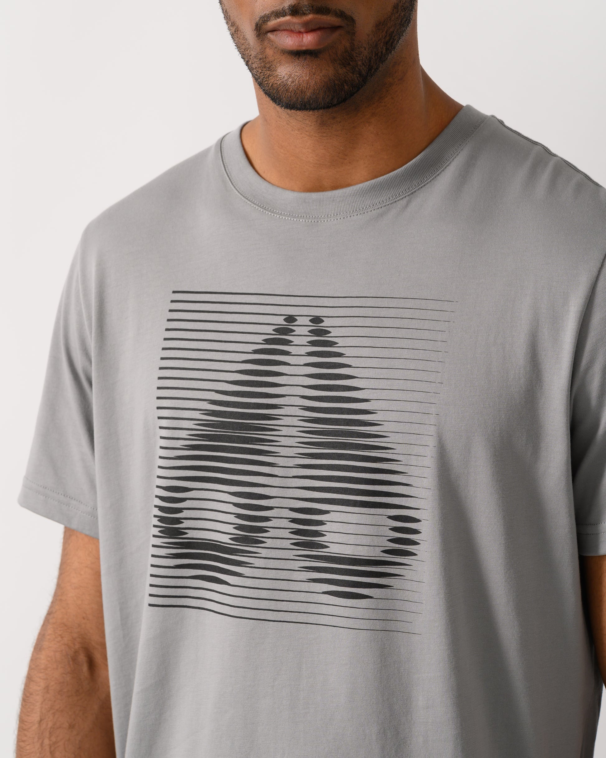 close up of model wearing a Moose Knuckles Raydaze Mens T-Shirt in Industry 1892 colourway