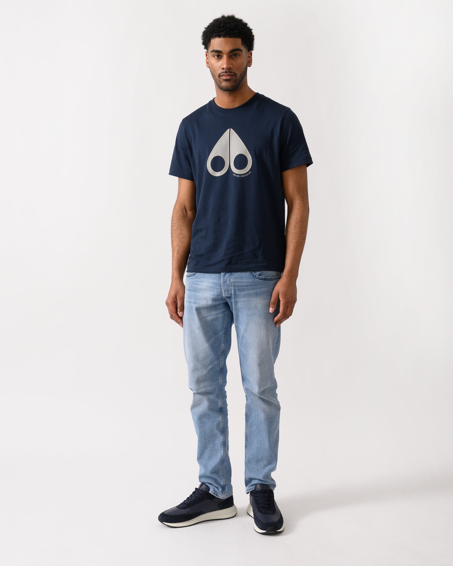full length shot of a model wearing a Moose Knuckles Tandem Mens T-Shirt in Navy 833