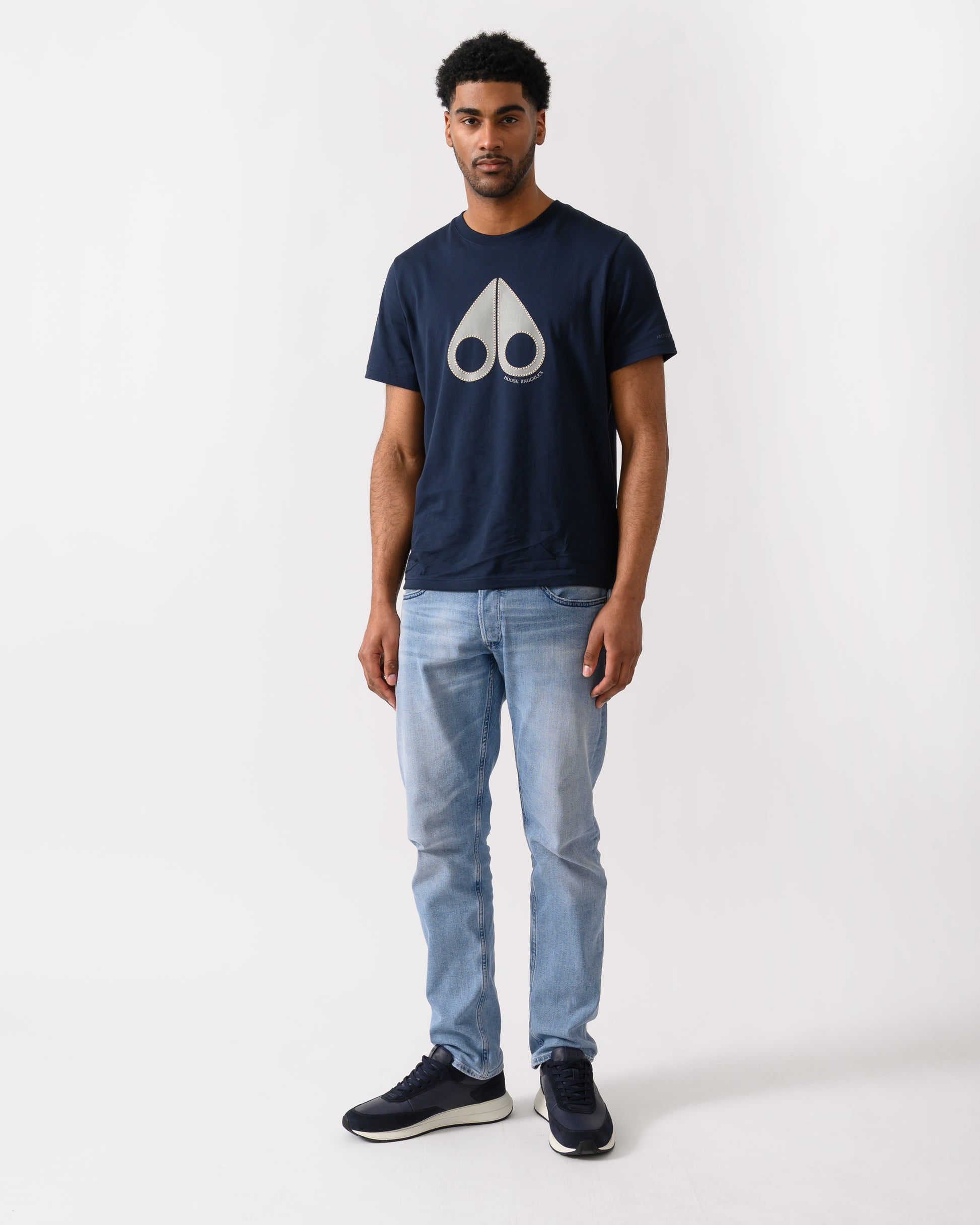 full length shot of a model wearing a Moose Knuckles Tandem Mens T-Shirt in Navy 833