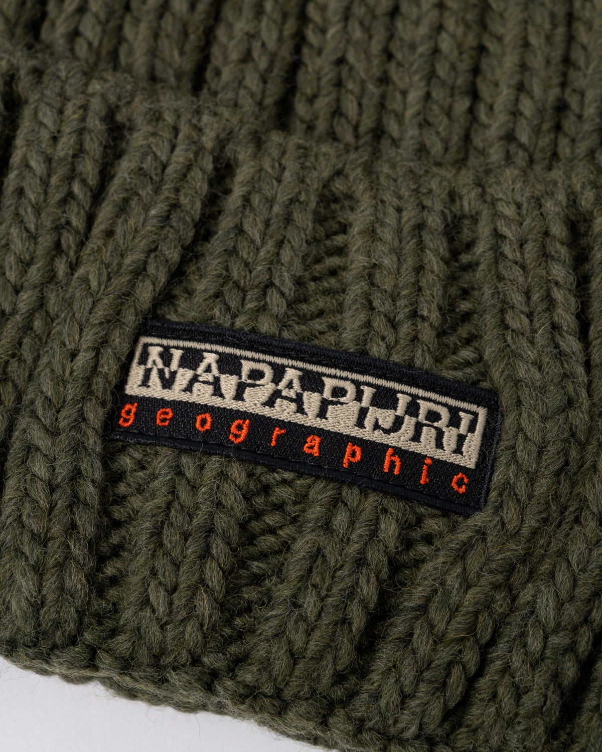 logo detail of Napapijri Fea 2 Bobble Hat in Olive Night G1F