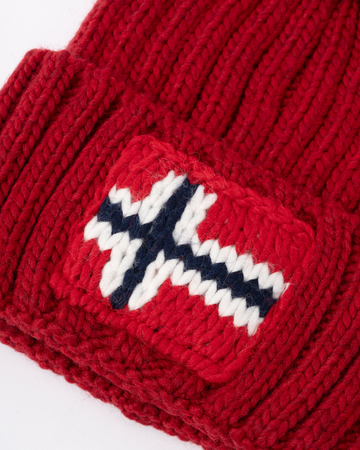 logo detail of a Napapijri Semiury 5 Bobble Hat in Haute Red R1F