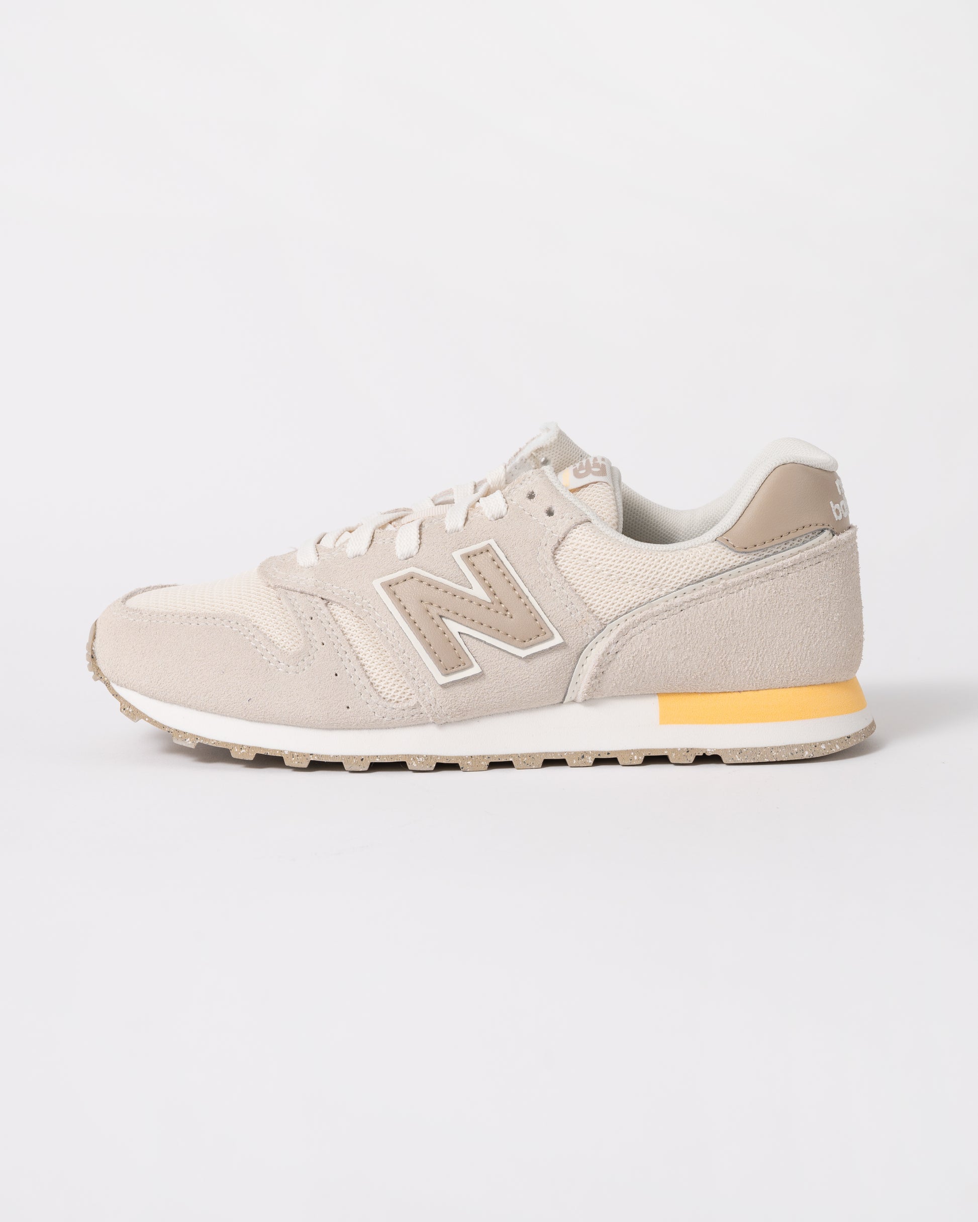 side of New Balance 373 Womens Trainers in Linen