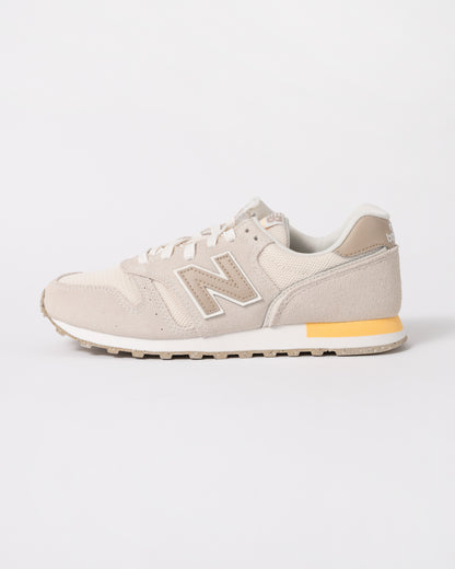 side of New Balance 373 Womens Trainers in Linen